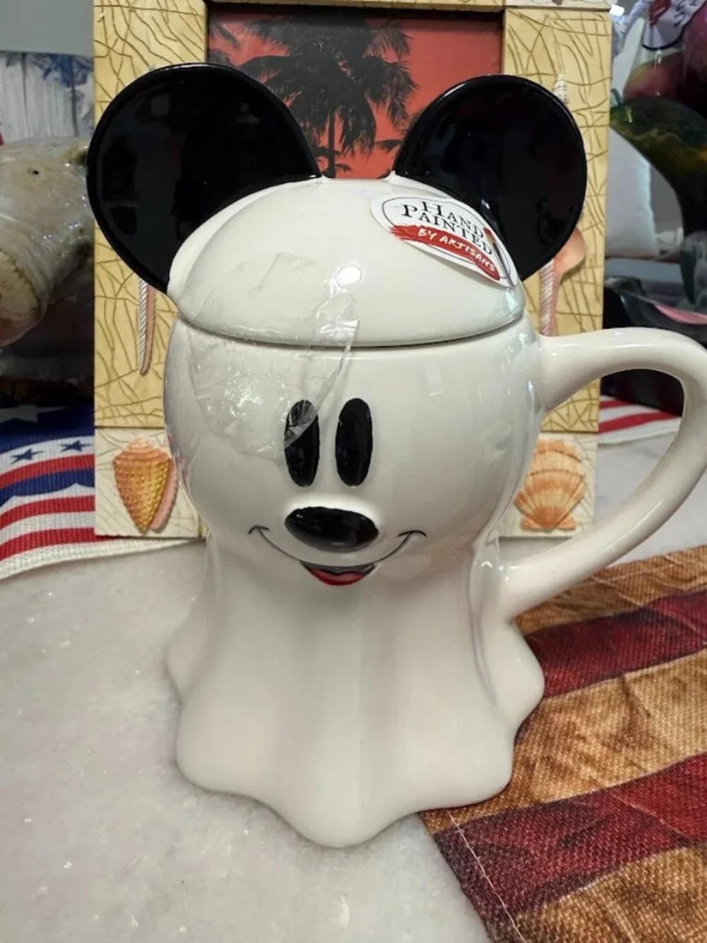 This Disney Mickey Mouse Ghost Coffee Mug with Ears Lid is a unique and fun